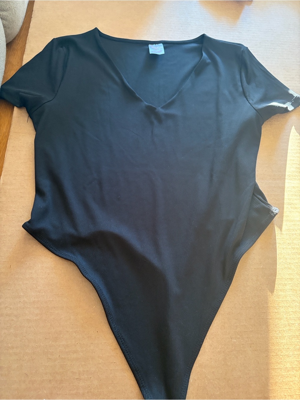 Women’s Black Short Sleeve V‑Neck Thong Bodysuit